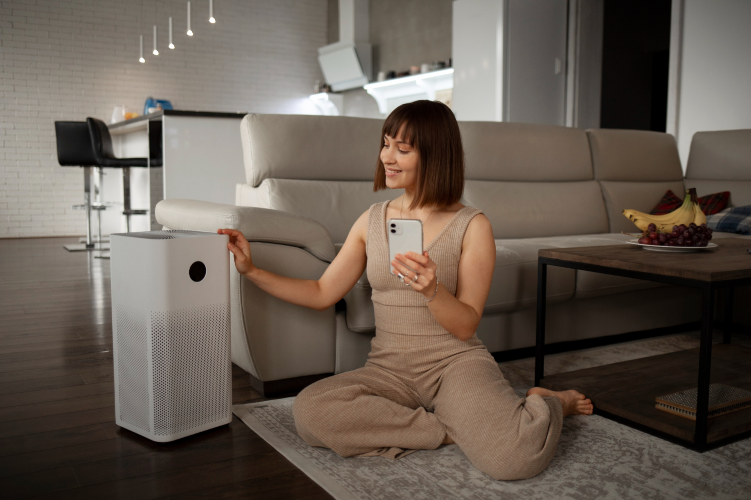 Girl sitting happily beside HVAC humidifiers enjoying comfortable indoor air